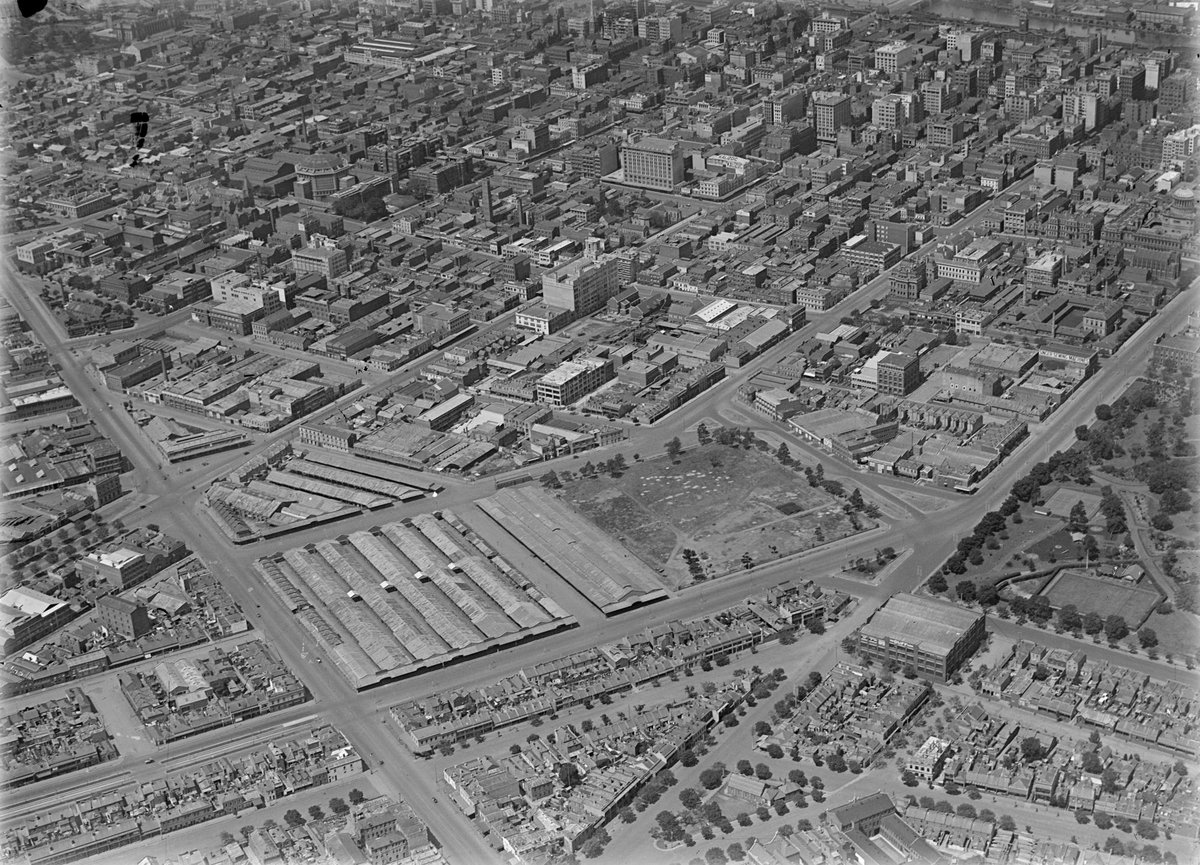 Queen Victoria Market in foreground, looking over City of Melbourne, Flagstaff Gardens on right, Melbourne City (1926–27)
