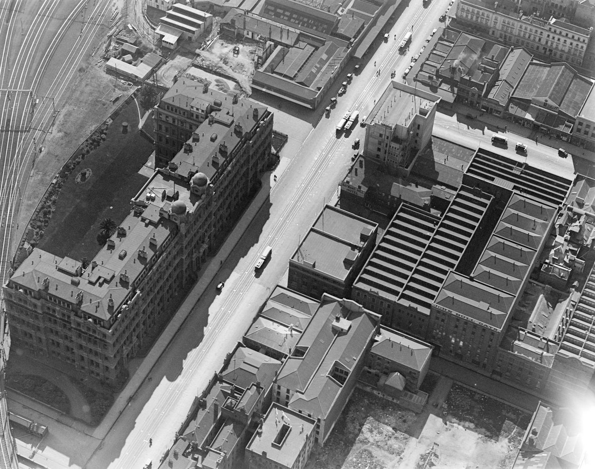 Spencer Street near intersection with Flinders Street, Melbourne, showing railway tracks, Melbourne City (1925–40)