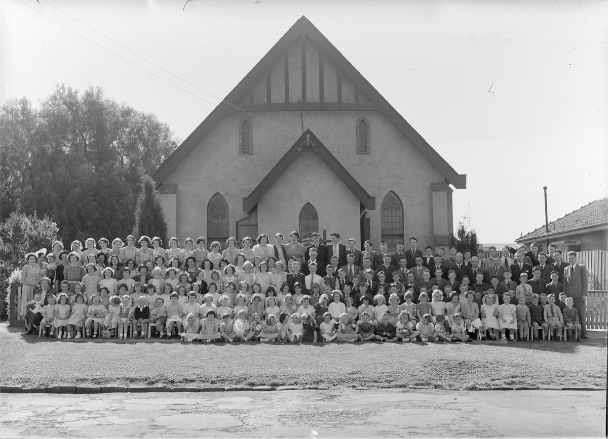 Large group of men, women and children outside Church of Christ, Berry Street, North Essendon, Essendon North (1948–54)