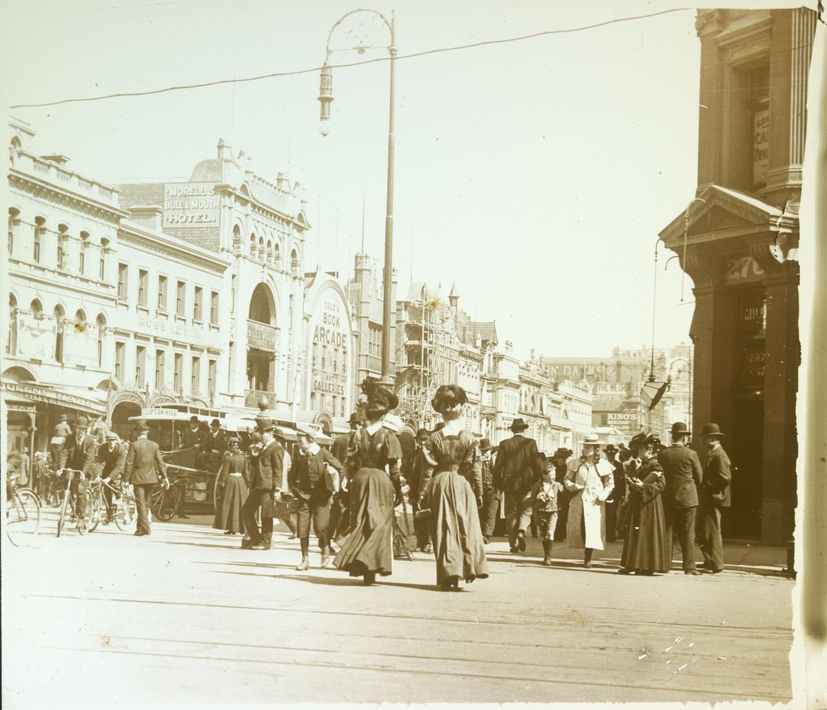 Pedestrians crossing street at intersection of Bourke and Swanston Streets, Melbourne, Melbourne City (1880–1938)
