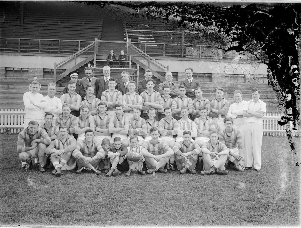 North Melbourne (VFL) Thirds Premiership team in front of a grandstand, Arden Street (1946)