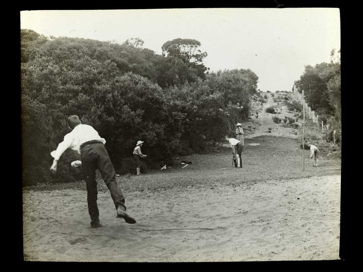 Boys playing cricket on track beside "Ivanhoe" - 1909 [Sorrento]
