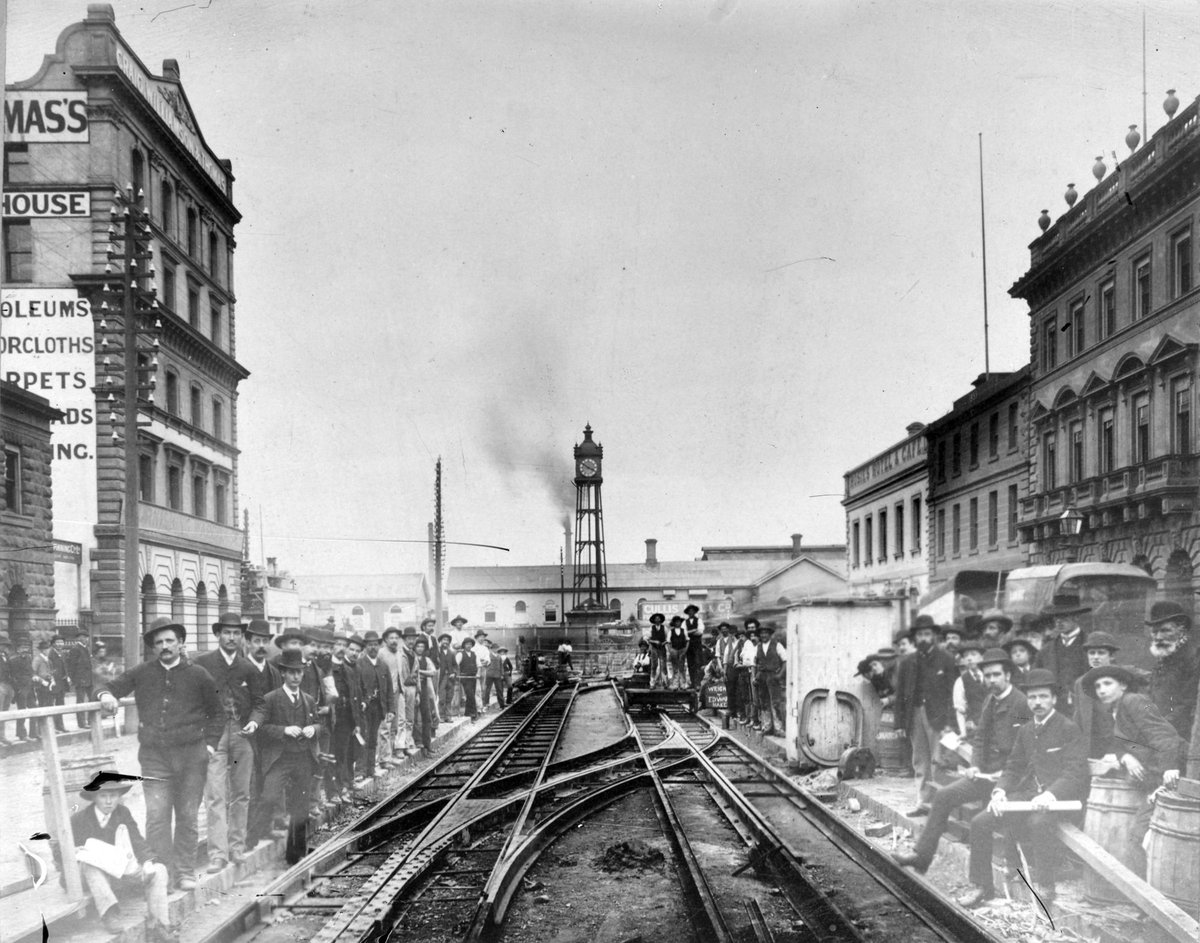 Laying of cable tram tracks in Elizabeth St. looking towards Flinders St. Station, Melbourne City (c. 1920)
