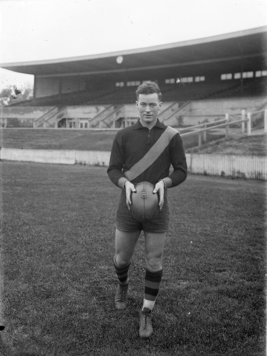 Richmond football player Leo Merrett holding a football (1945–49)