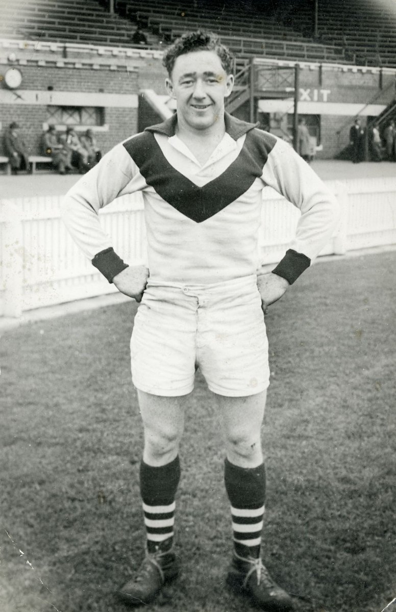 "Two South Melbourne football players, Eddie Lane and an unidentified player, standing on field" (1951–54)