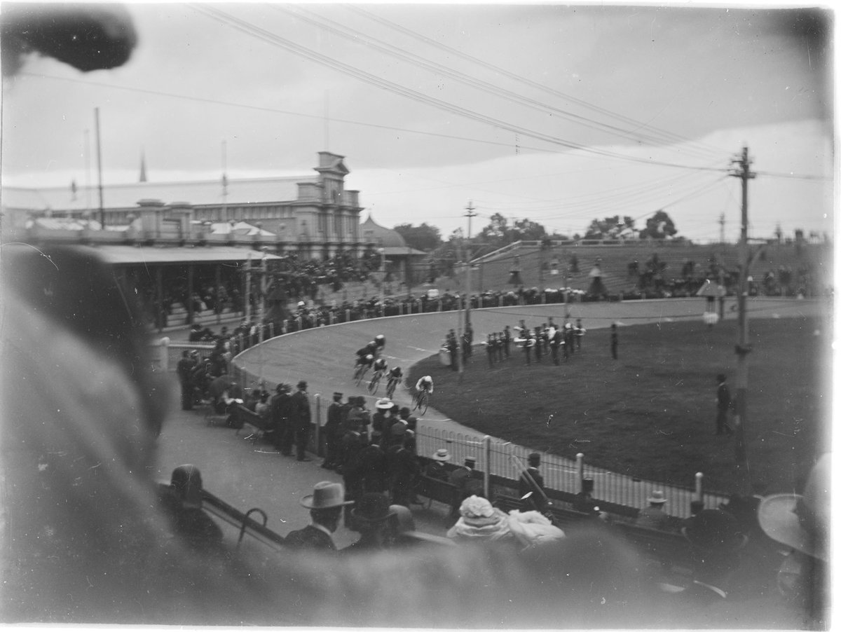 Bicycle race viewed from stand, possibly in Melbourne (c. 1910)