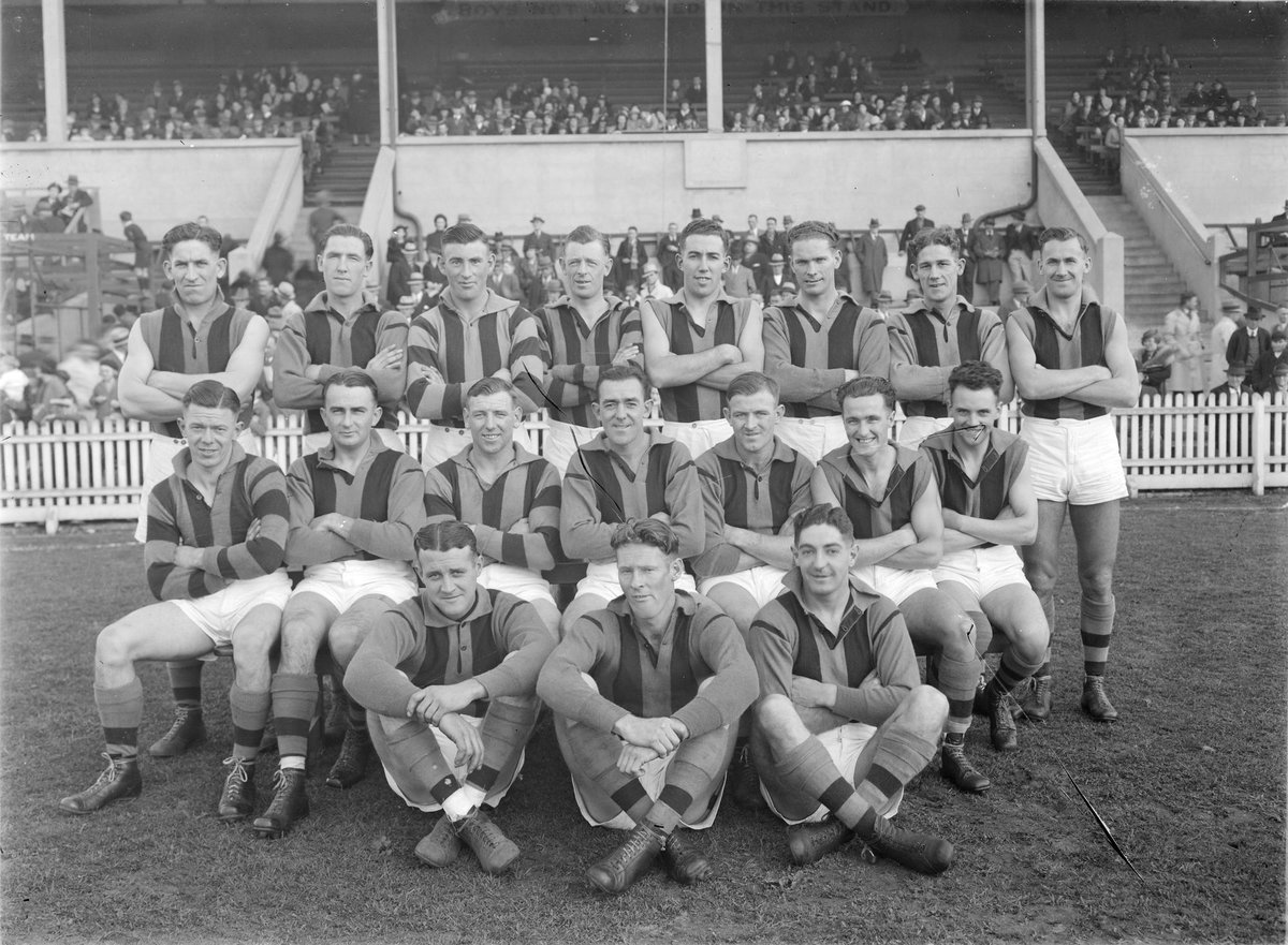Port Melbourne senior football team in front of a grandstand (1938–39)
