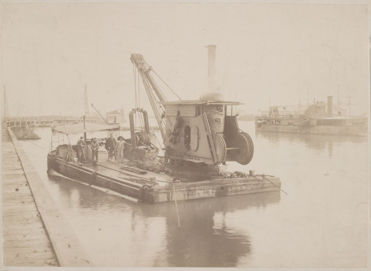 [Men standing beside crane fixed to a wooden pontoon, Yarra River, Melbourne] (1884–85)