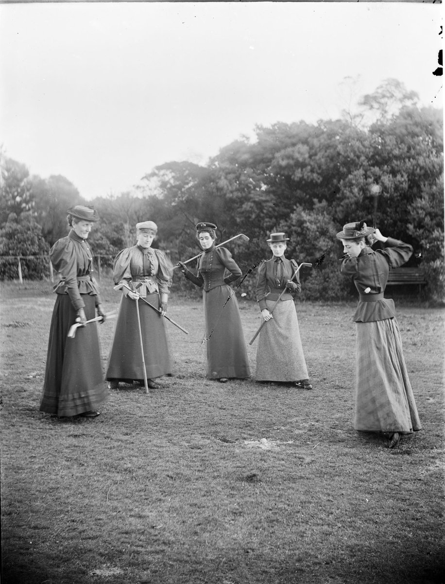 Women members of the old Kew Golf Club, Mrs. Anderson in centre, standing in semi-circle, holding golf clubs (1890–1910)