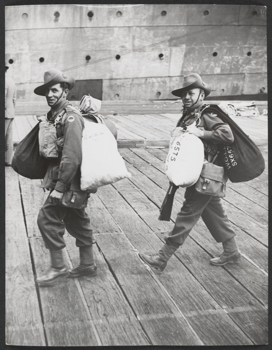 Two A.I.F. men arrive at the wharf with kitbags, ready for embarking from Port Melbourne (c. 1941)