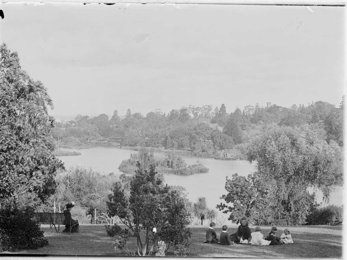 A picnic group in front of the lake, Botanical Gardens, Melbourne, Melbourne City (c. 1900)