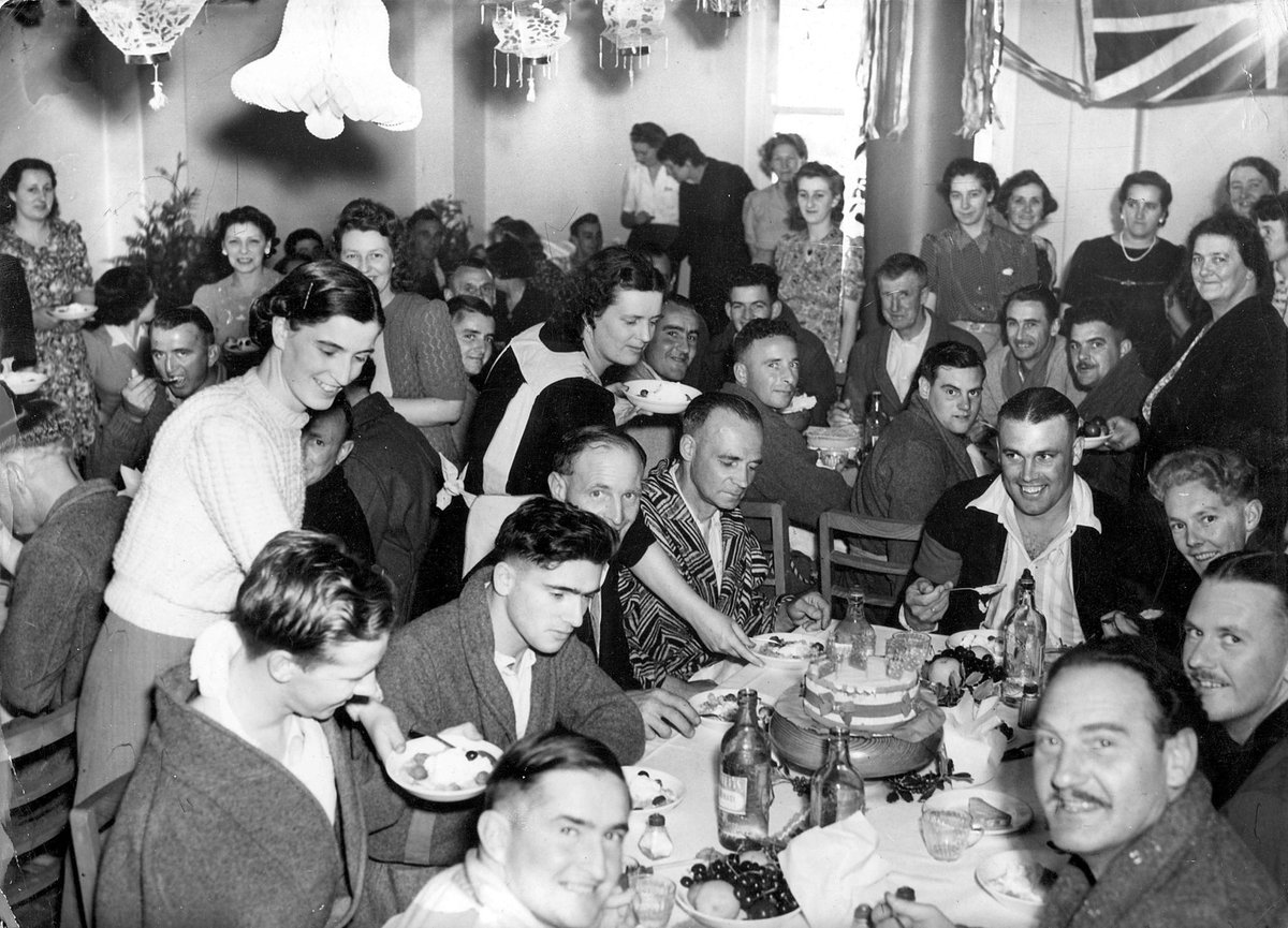 Christmas treat for the men of 3E at Heidelberg Military Hospital supplied by the girls of B shift of Dominion Can Co. Annex. These girls go out to this hospital each week with flowers & amenities (1940–45)