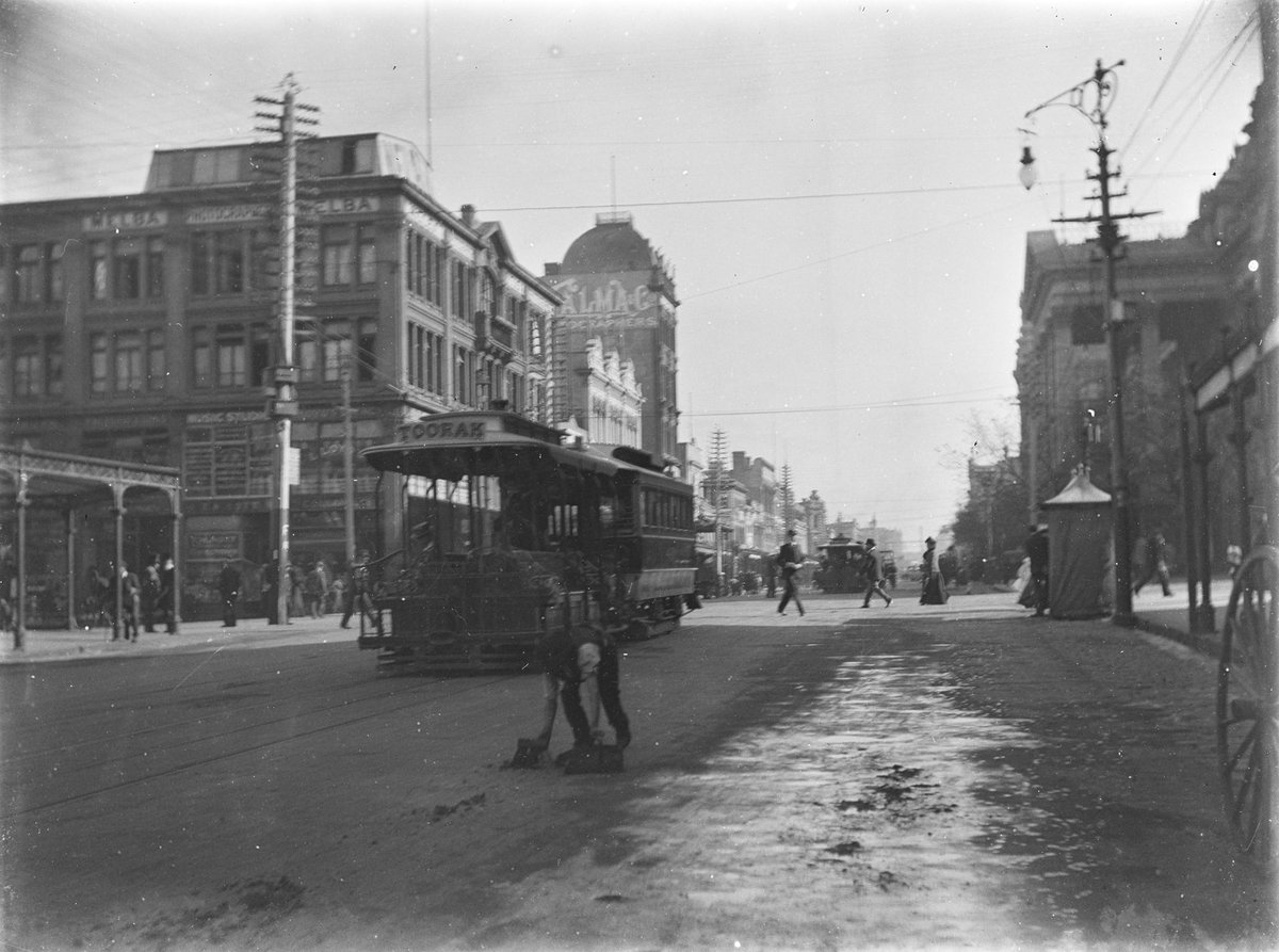 Swanston & Collins Street corner looking North showing the Talma and Melba Photographic Studios, Melbourne City (c. 1910)