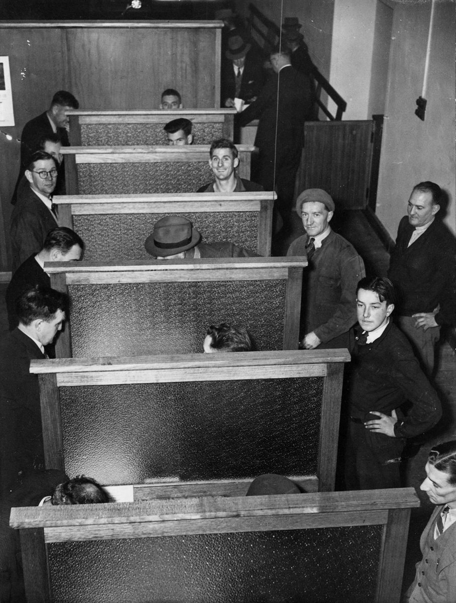 Interviewing applicants at the National Service Rooms in Elizabeth Street, Melbourne, Melbourne City (c. 1942)