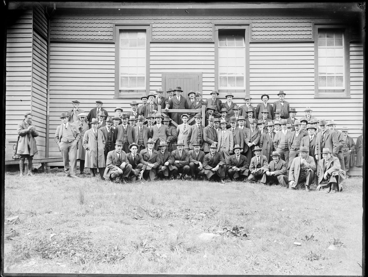 Portrait of a large group of men outside the Diamond Creek? hall (1910–18)