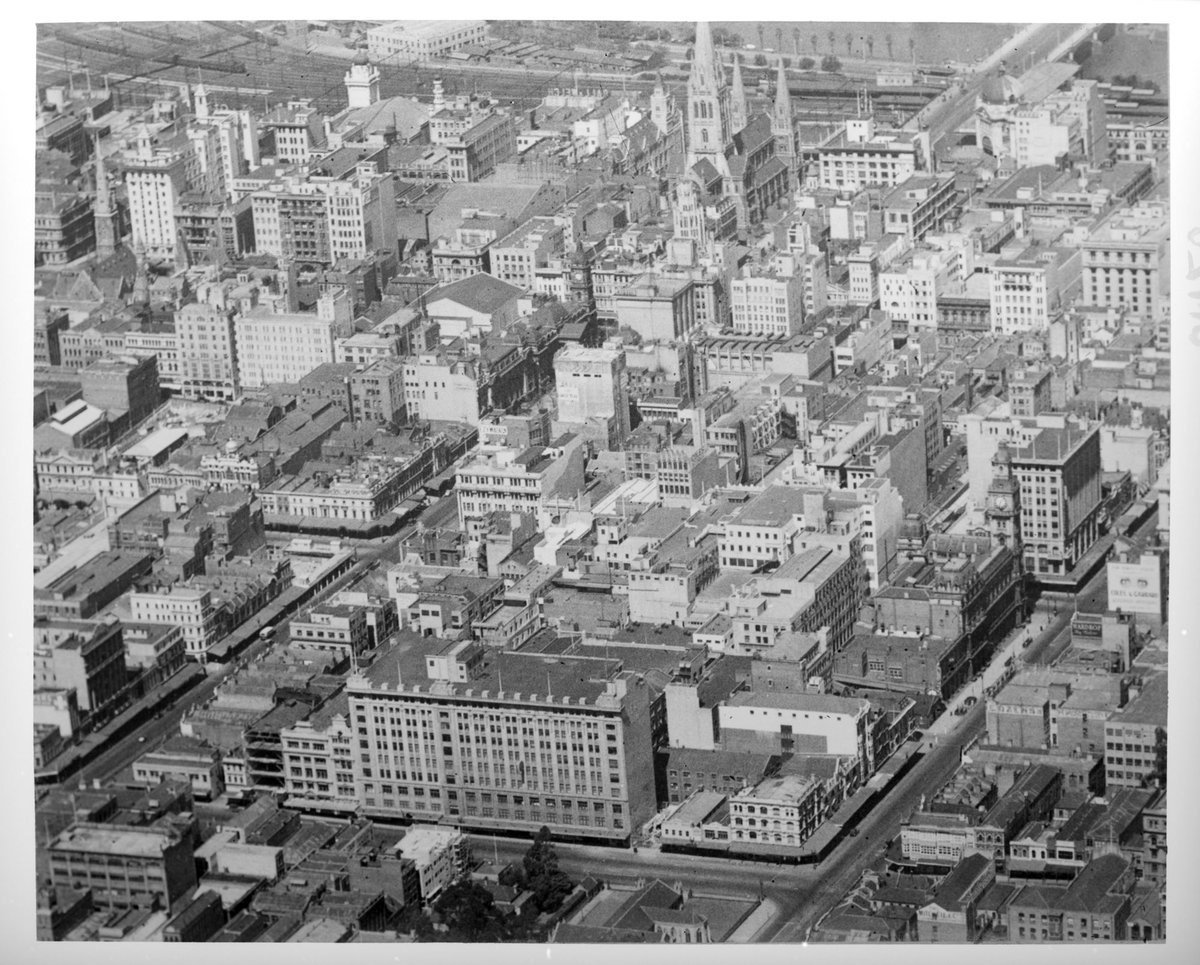 Aerial view of Melbourne looking south east from above the corner of Lonsdale and Elizabeth Streets, Melbourne City (1935–36)