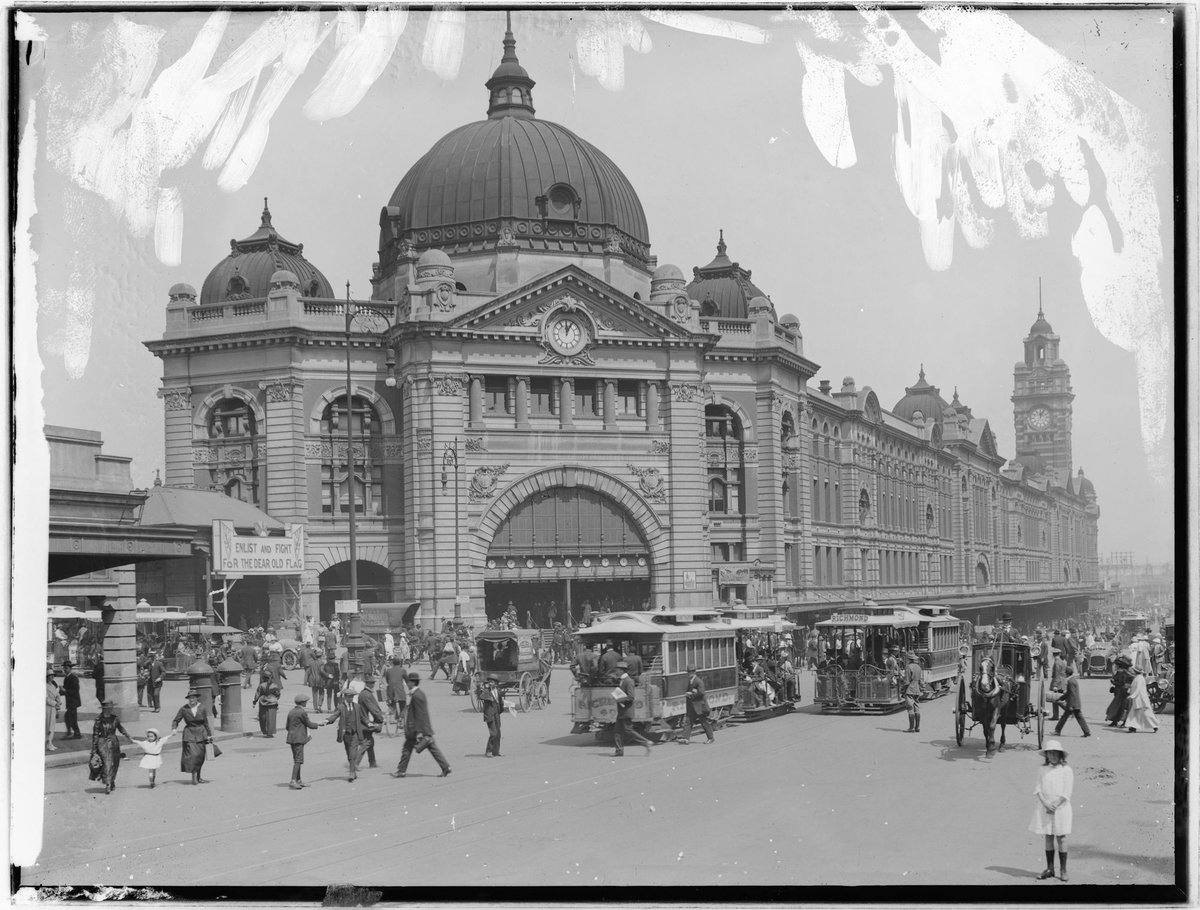 Flinders Street Railway Station taken from diagonally opposite the main entrance during World War I, Melbourne City (1916)