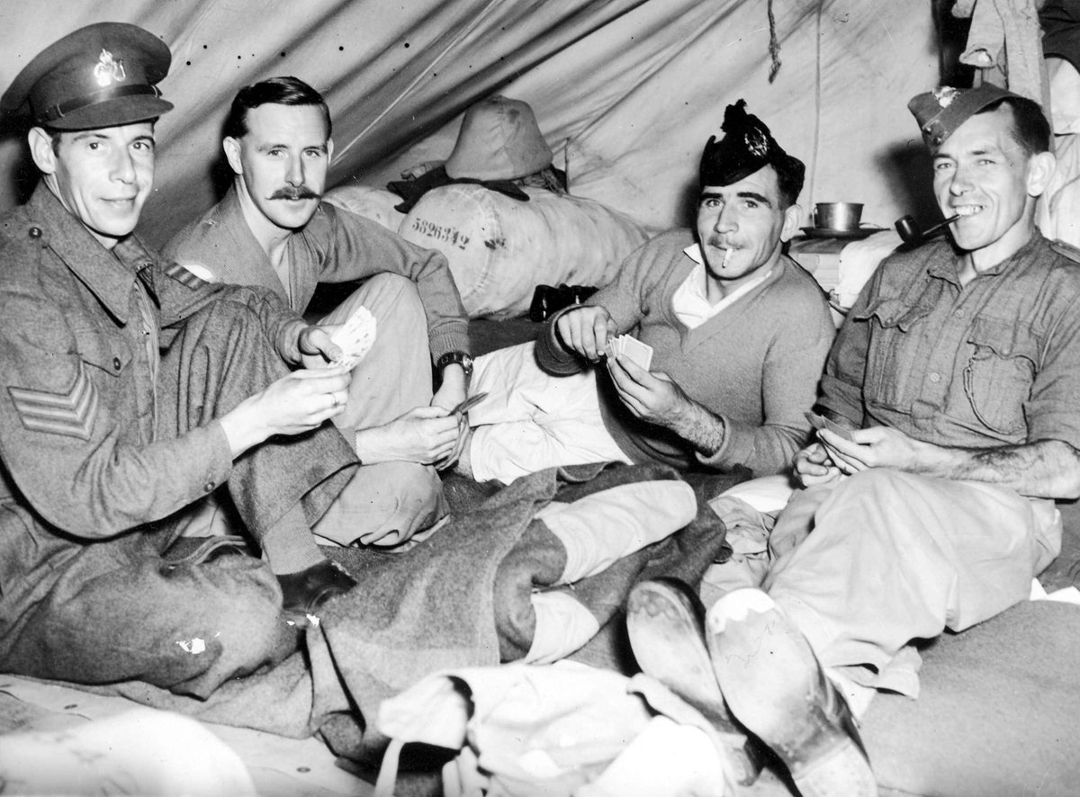 Allied soldiers playing cards in tent at Camp Pell, Melbourne (c. 1944)