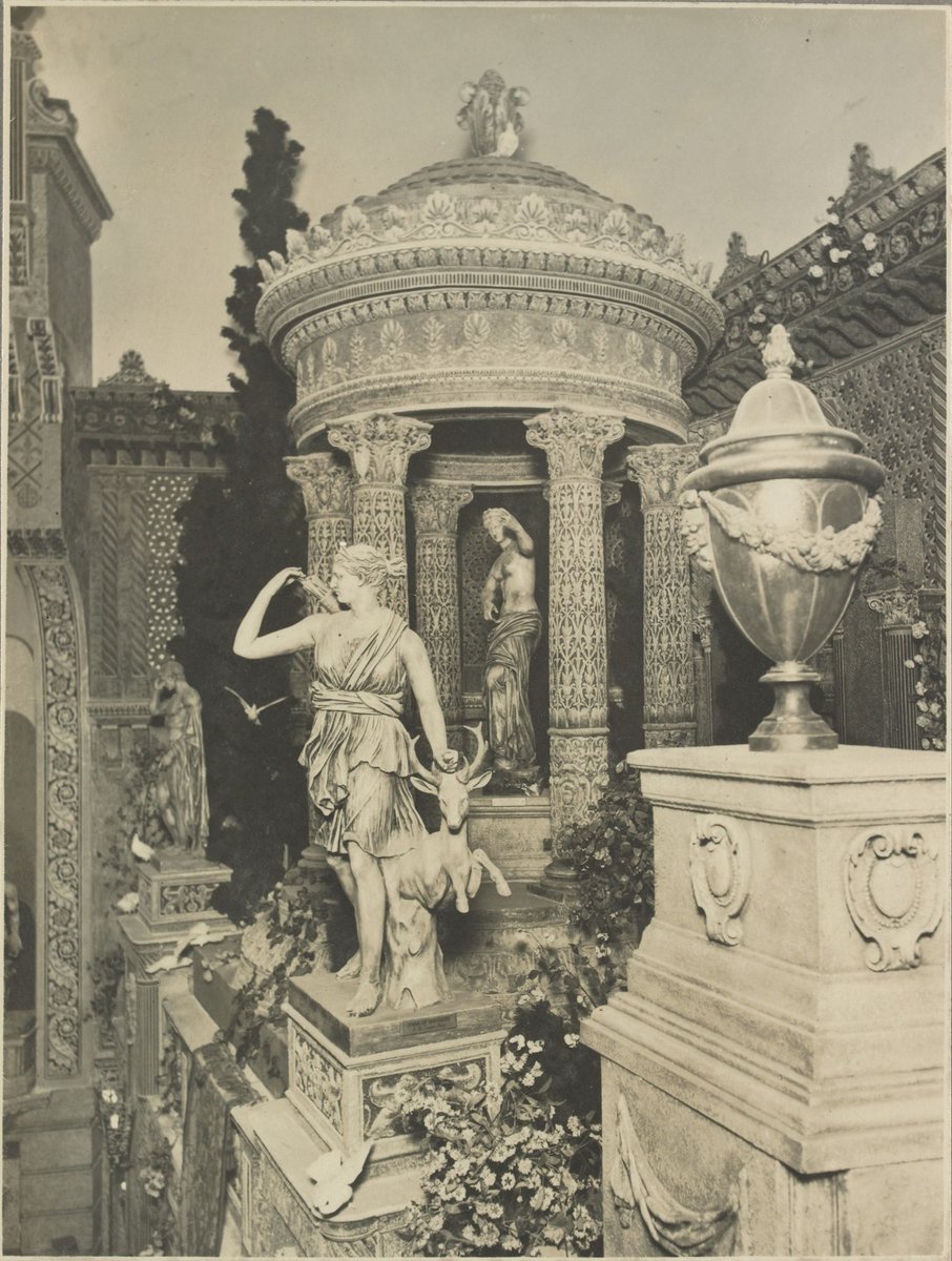 View of the interior of auditorium at the State Theatre Melbourne towards the right hand side of the stage showing statue of Diana of Versailles with stag, a temple with a statue of Aphrodite and an urn on a pedestal in the foreground (c. 1928)