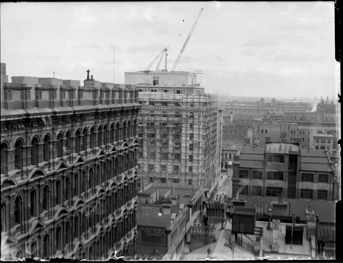 Port Authority building being built, looking down Flinders Lane to Spencer Street from the rear roof of 395 Collins Street (Goode House) on the corner or Collins and Queens Streets, Melbourne, Melbourne City (c. 1929)