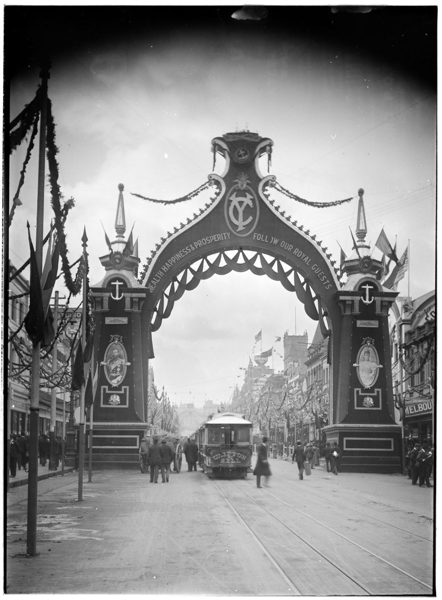 Arch across Bourke Street, with the words Health Happiness & Prosperity Follow Our Royal Guests, Melbourne City (c. 1901)