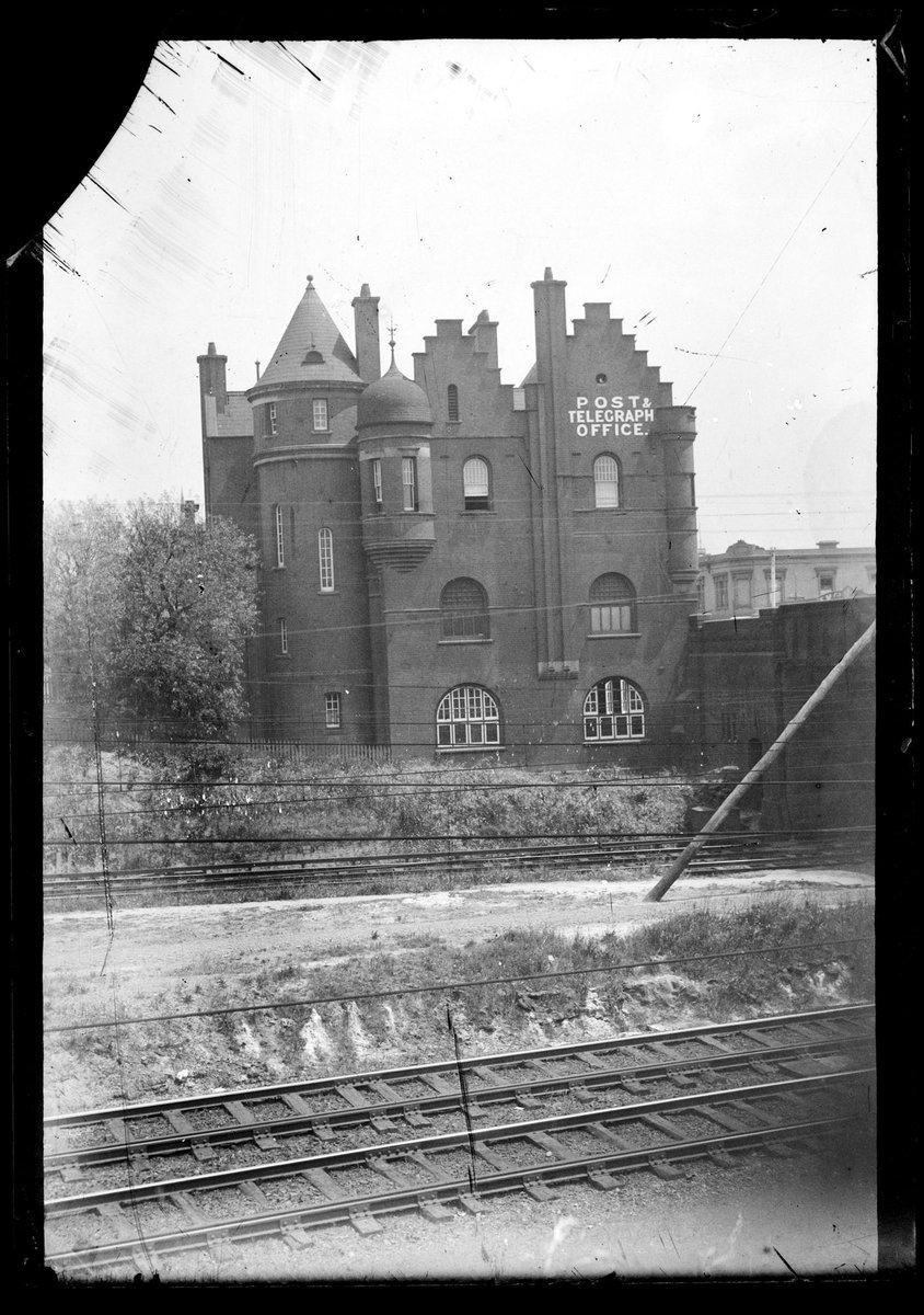 Former South Yarra Post Office, railway lines in foreground, railway bridge on right (1900–30)