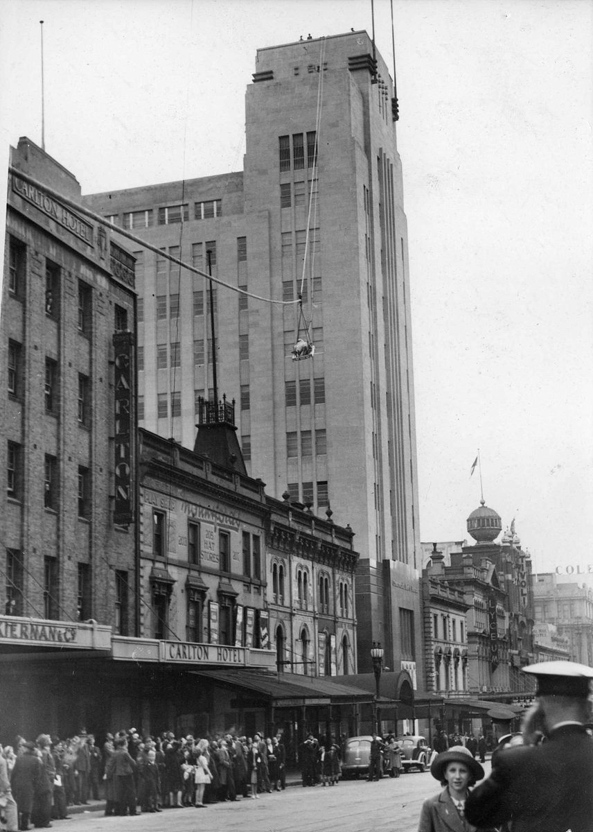 Casualty lowered from Commonwealth Bank roof, Bourke St, Melbourne City (c. 1942)