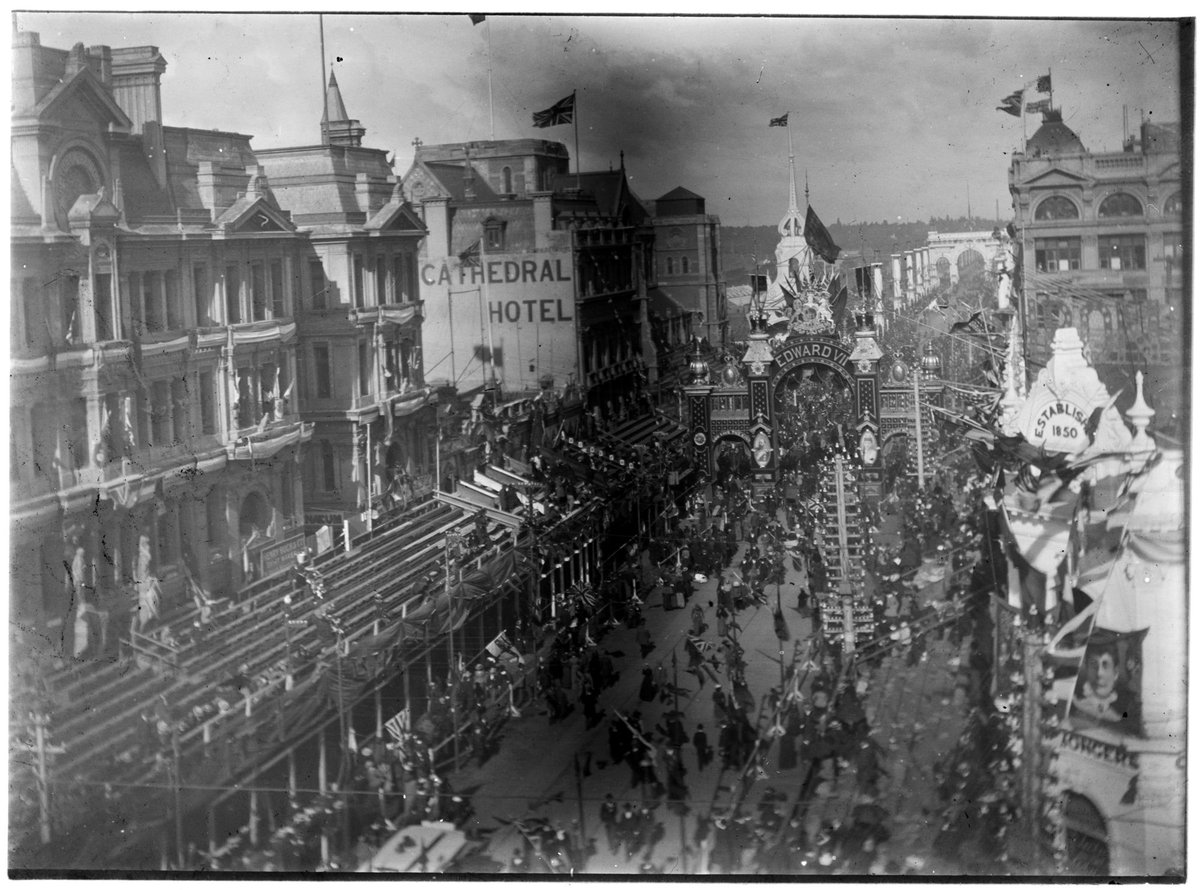 Overhead view of Swanston Street, showing arch with Edward VII written across it and the Cathedral Hotel on the left, Melbourne, Victoria, Melbourne City (c. 1901)