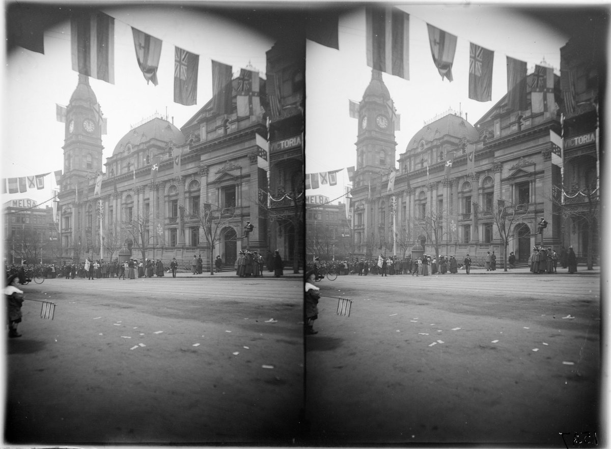 Collins Street view with Town Hall and flags across street, Melbourne City (1890–1910)