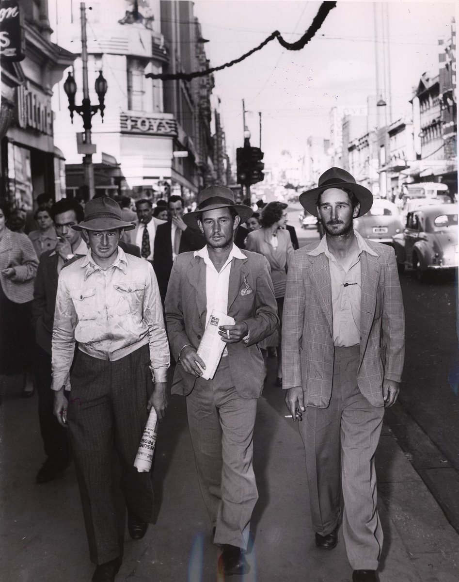 Bushmen after their three months trek with 2000 sheep arrive in Melbourne, Melbourne City (c. 1954)