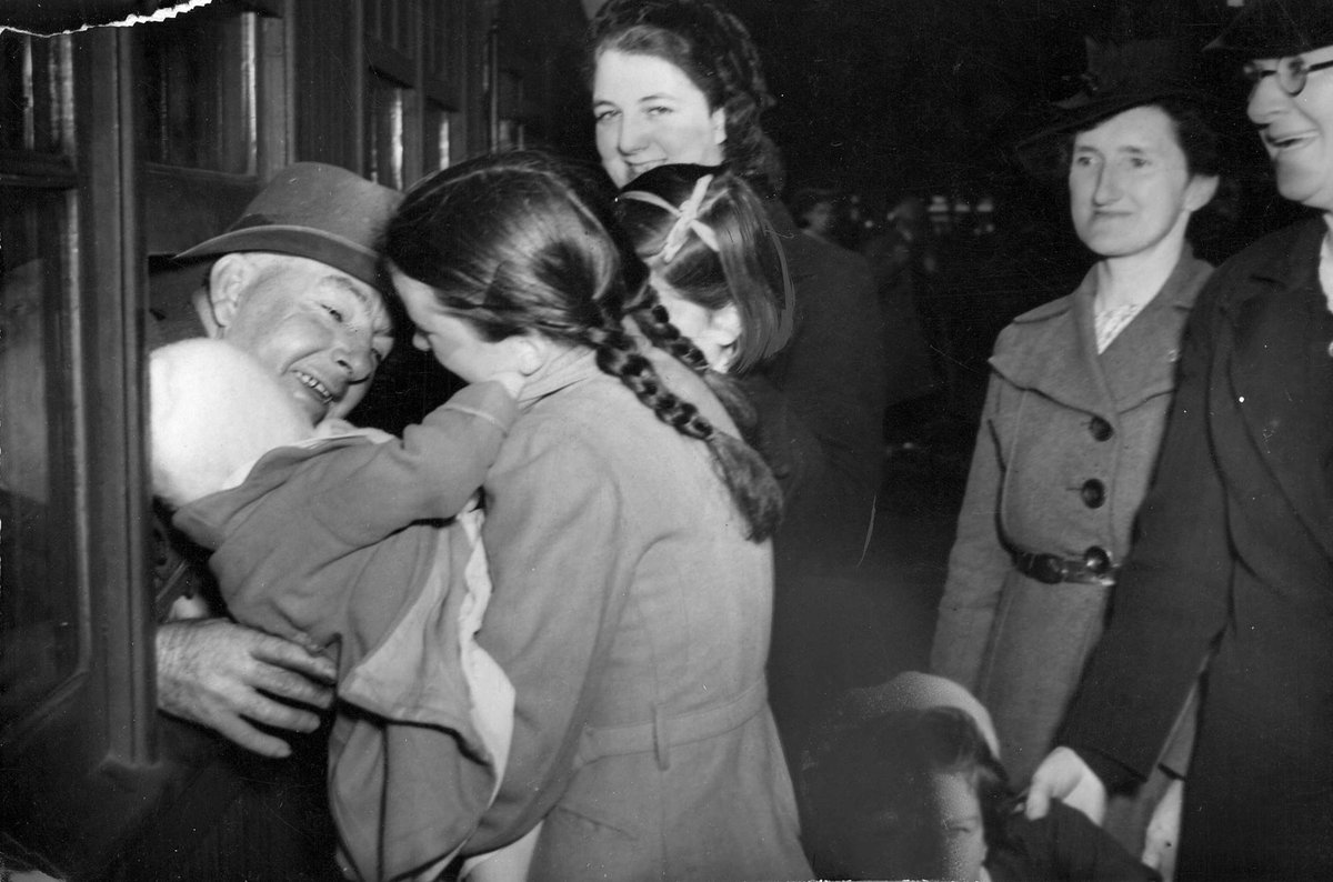 Sgt. M. L. O'Brien greeted by family & friends on return to Melbourne (c. 1942)