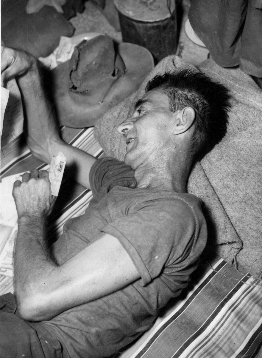 BANKOK. (This picture was not posed) Pte. A. C. GINGER, Footscray ... likes to see the home writing (c. 1945)