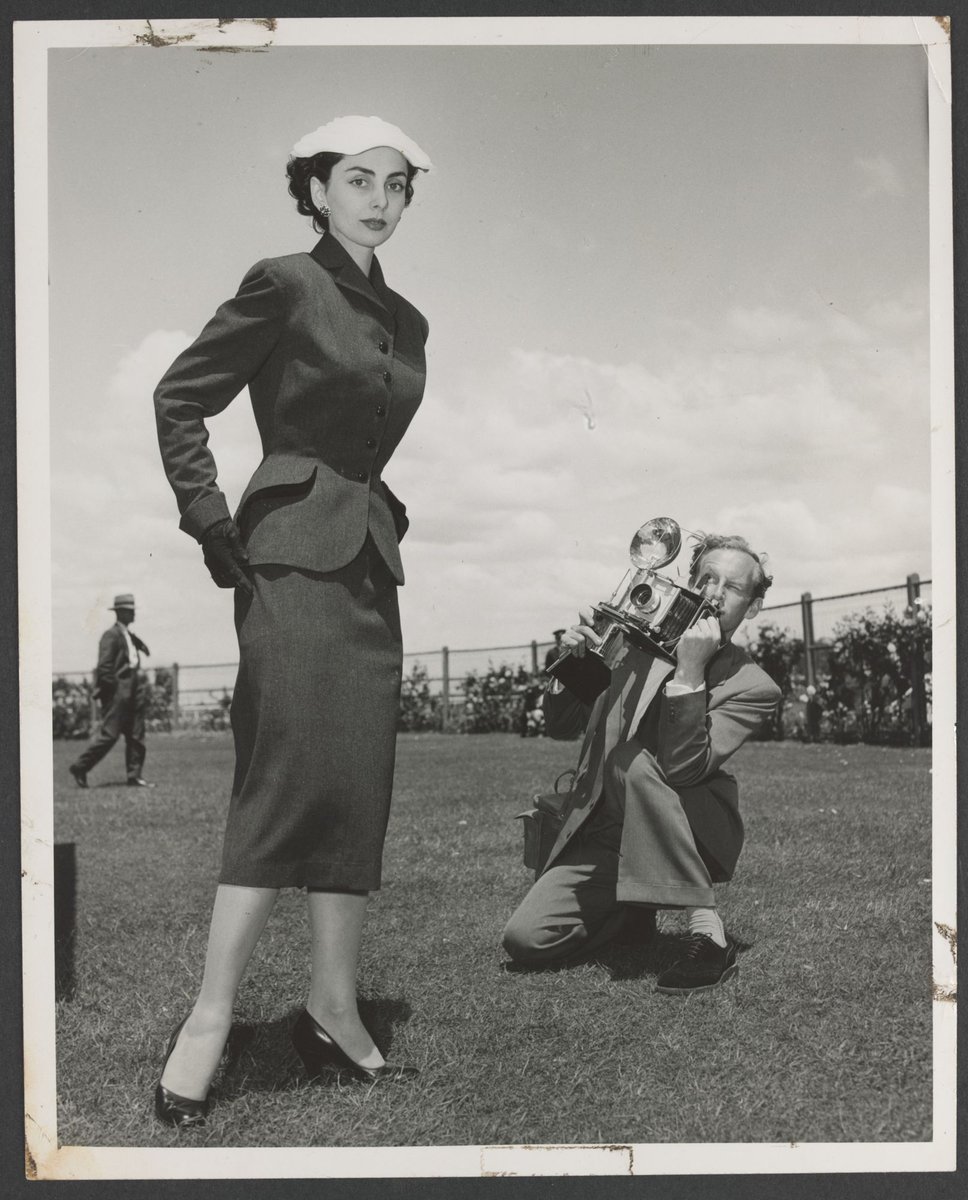 Portrait of Norman Ikin photographing model at Caulfield races (1950–54)