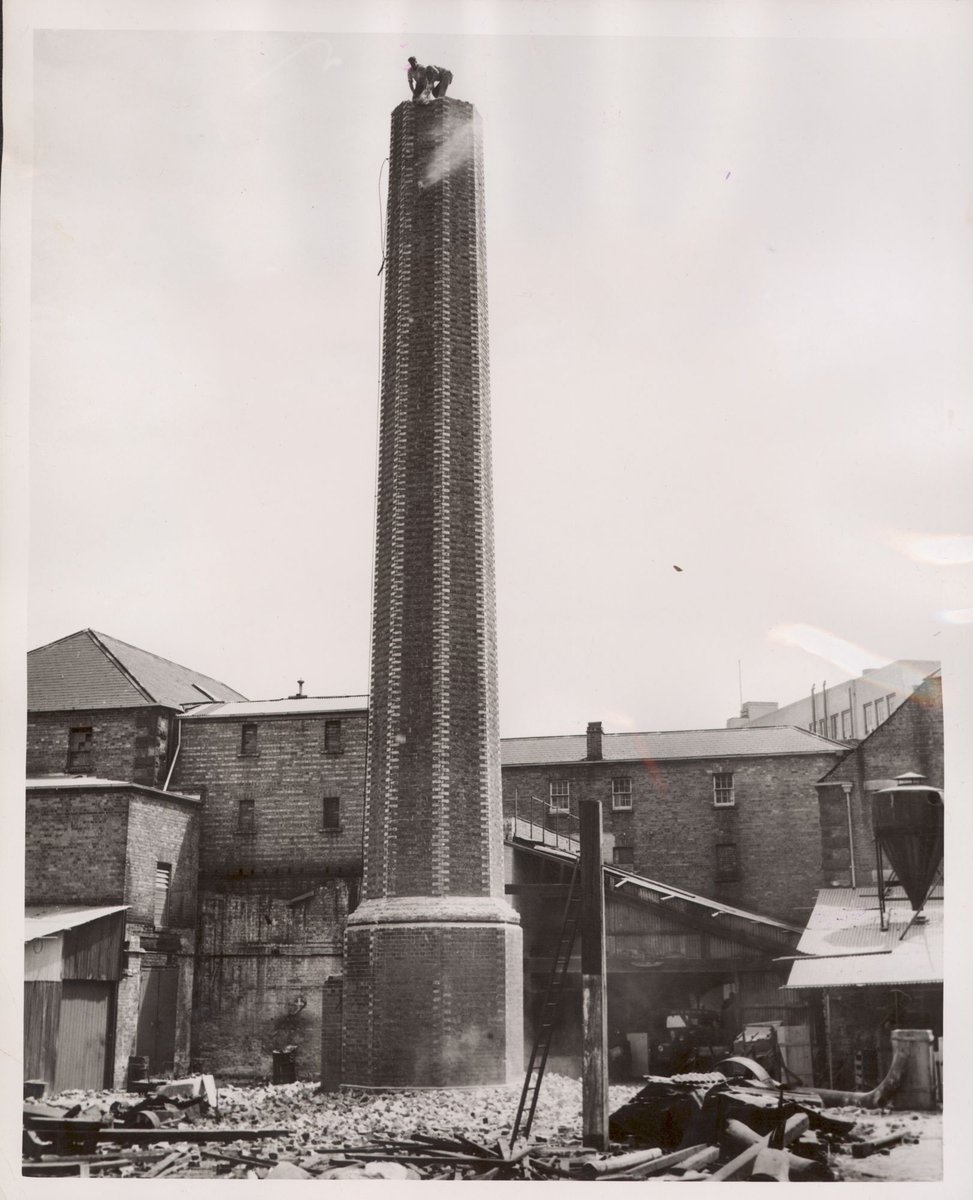 Chimney being demonlished [i.e. demolished] at Carlton (1954)