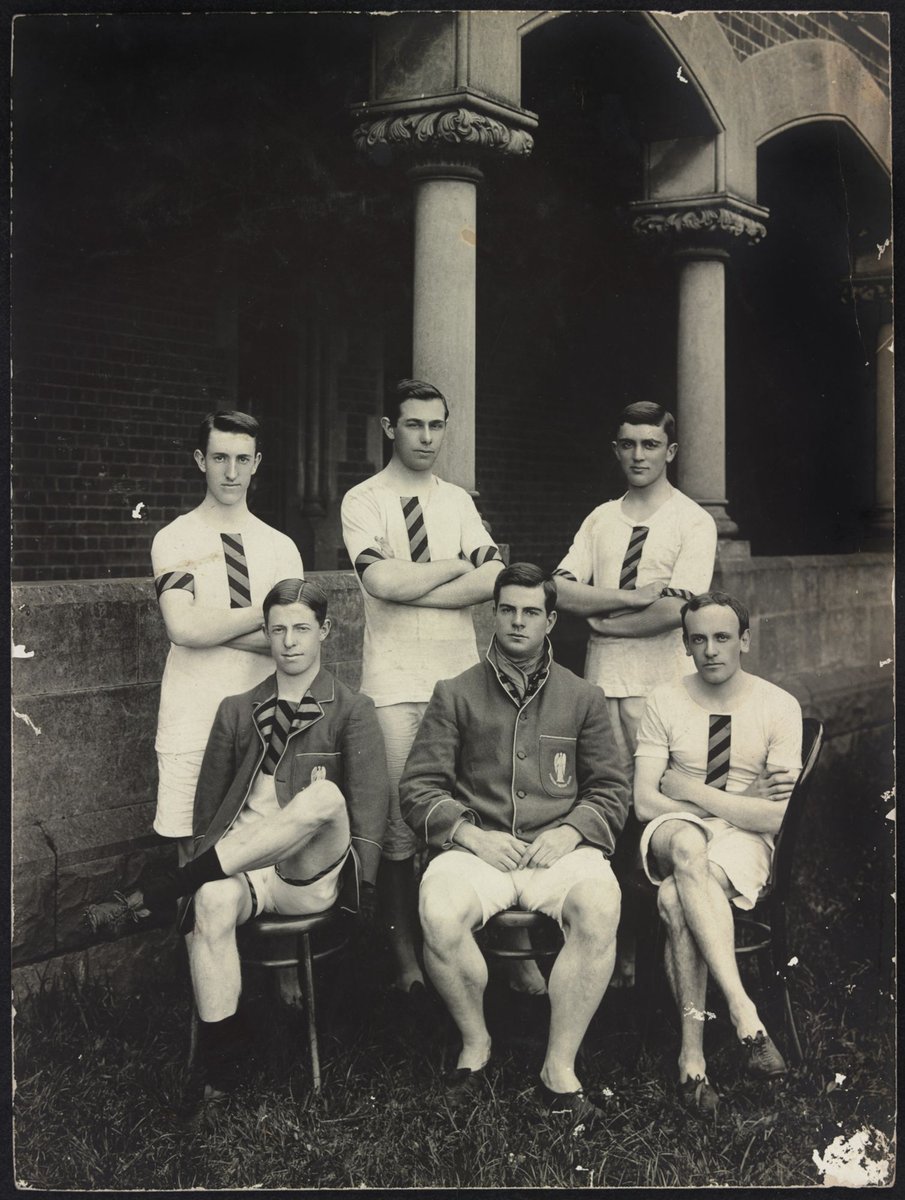 Six athletes outside Trinity College, University of Melbourne, whole-length with front three seated, Parkville (c. 1910)