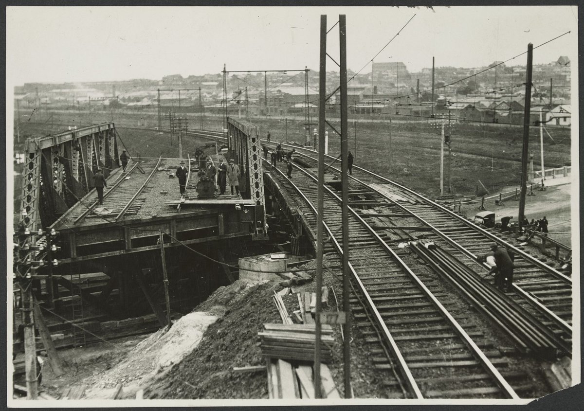 [Railway construction during the widening and expansion of Flemington Bridge over Racecourse Road, Flemington] (1929)