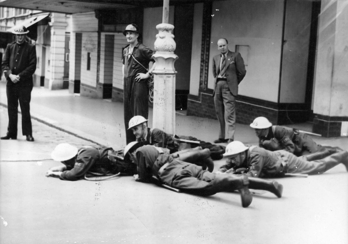 Air Raid Precautions Squad during display in Melbourne - lying down during air raid (c. 1943)