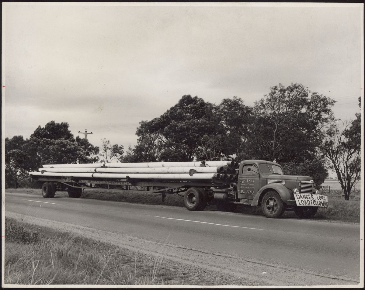 A Delivery Of Pipe Sections To The Site On The Melbourne/Geelong Road For Construction Of Shell Refinery, Geelong, Vic (1953?)