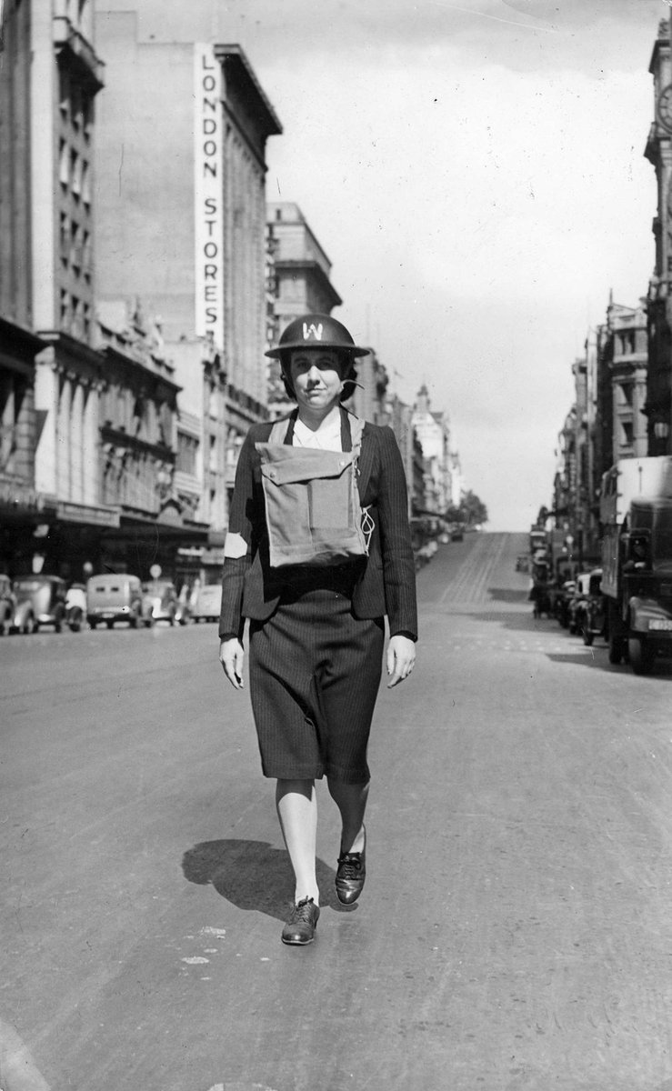 Warden of a Gas reconnaissance unit on patrol in deserted Bourke St, Melbourne City (c. 1942)