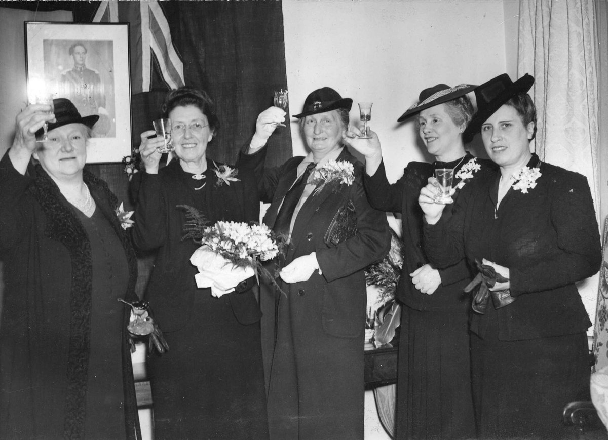 Marie de Babay, Mme. Rene Vanderkelen, wife of Belgian Consul, Mme. A. Lodewyckz, Mrs. F. H. Wright, Mme. Nicoladis toasting the liberation of Belgium at the Toorak residence of the Belgian Consul (c. 1944)