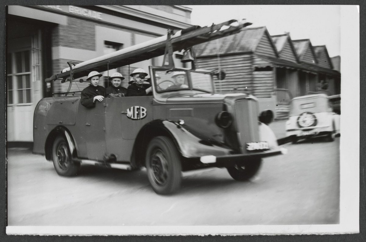 North Melbourne Auxiliary Firemen leave the station on receiving a call (c. 1942)