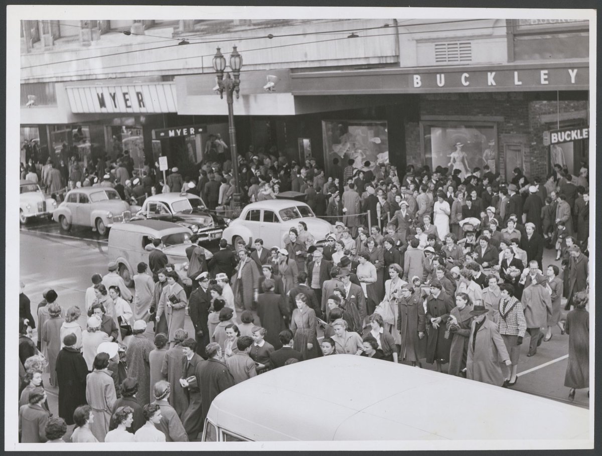 Large group of pedestrians crossing over Bourke Street, Melbourne, near the main entrance of Buckley and Nunn, Melbourne City (c. 1948)