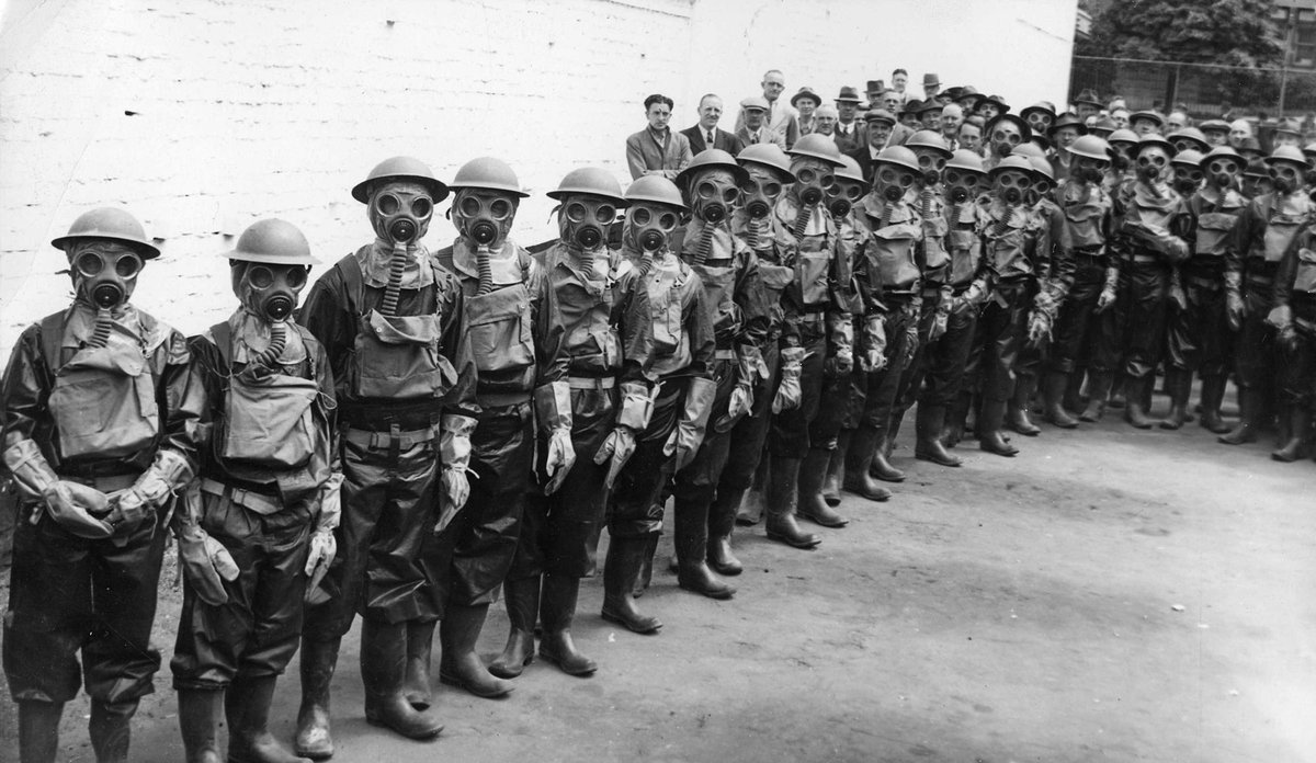 Auxiliary Ambulance Driver, ... at Ambulance headquarters Lonsdale St. during massed practice in protective clothing, Melbourne City (c. 1941)