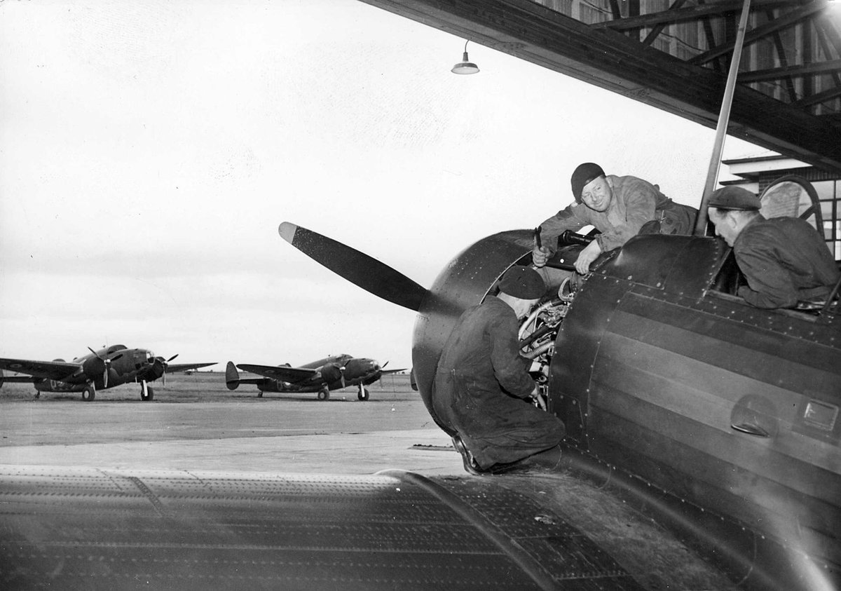 The men behind the scenes at R.A.A.F. Ground staff checking a Wirraway being used in "Battle for Melbourne" (c. 1941)