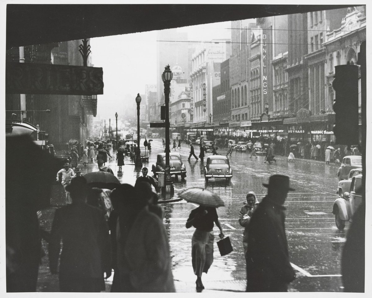 Sudden wet weather in Melb. [i.e. Melbourne] streets, Melbourne City (1953)