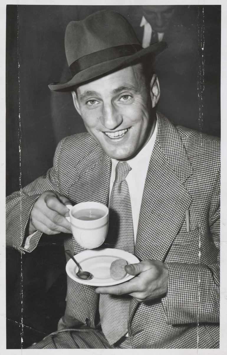 Len Hutton, Eng. [i.e. English] cricketer, spent the time at Essendon having a good old cup of tea as the plane was delayed 45 minutes (1951)