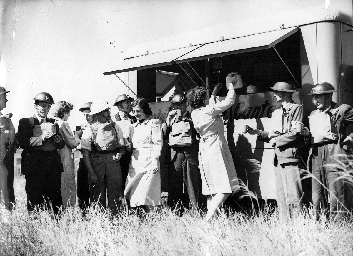 Essendon/Moonee Ponds Air Raid Precautions squad members line up at mobile canteen in Melbourne during World War II (c. 1942)