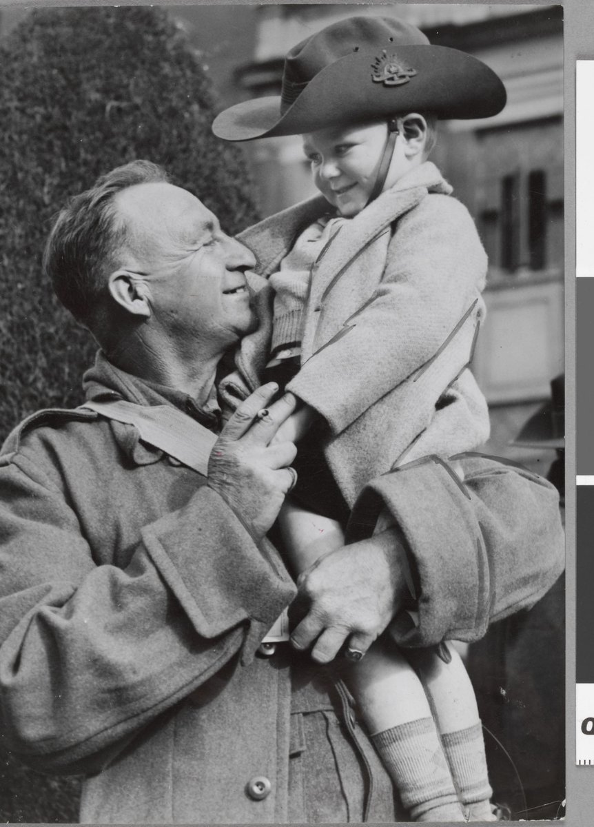 Cpl O. Hansen back with his son Rowland met after his return from Middle East to Caulfield (c. 1941)