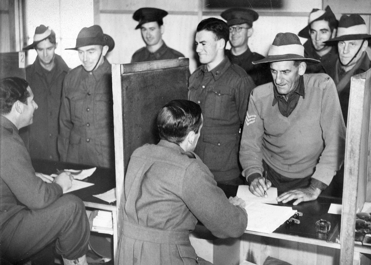 Dischargees signing papers at S.D.D. Royal Park, Parkville (1941–47)
