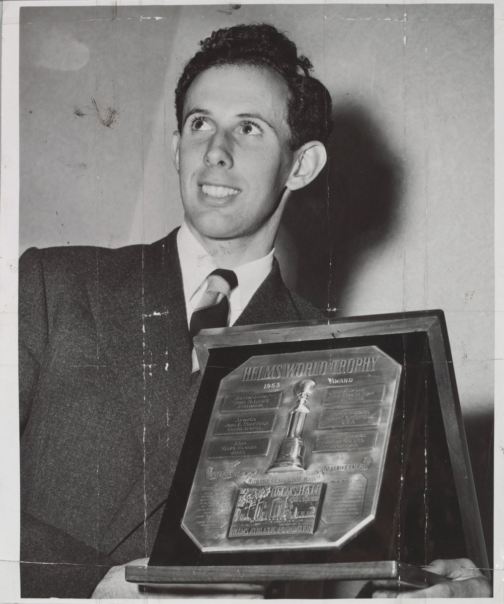 John Landy receives the Helms World Trophy for amateur sport at the Town Hall [Melbourne, Vic.] (c. 1954)